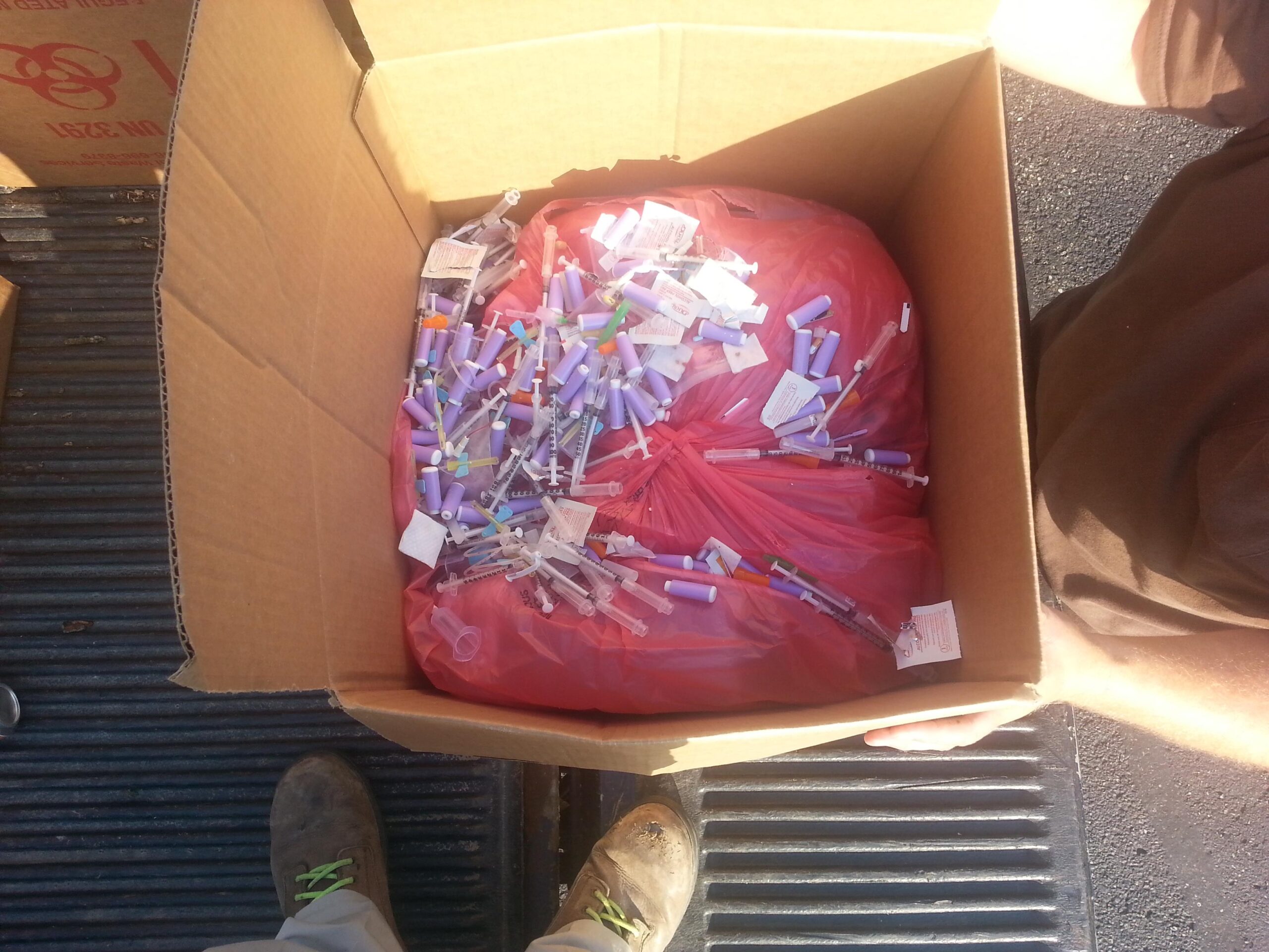 Loose sharps tossed in medical waste box