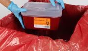 Sharps containers go in medical waste box for final disposal
